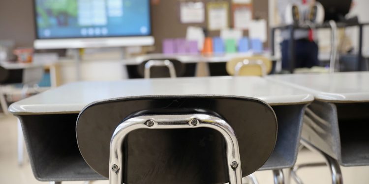 Desks and chairs sit empty in a classroom at Loring Flemming Elementary School in Blackwood, N.J.

TIM TAI / Philadelphia Inquirer