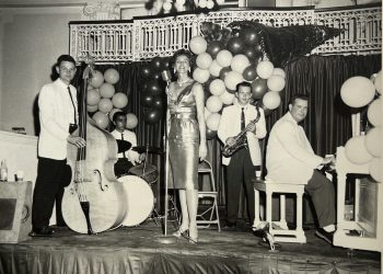 Hoby Bell and his orchestra featuring "Rita the Songbird.” Pictured, from left, are: Hoby Bell on bass, Cluey Sandy on drums, Rita at the microphone, Henry Stricek on saxophone and Jack Johnson on piano.