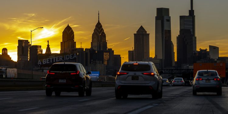 The sun sets behind City Hall and the Philadelphia skyline Dec. 3, 2021, photographed on southbound Interstate I-95, just north of Center City.

TOM GRALISH / Philadelphia Inquirer