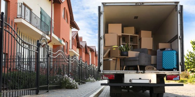 Van full of moving boxes and furniture near house

New Africa | Shutterstock