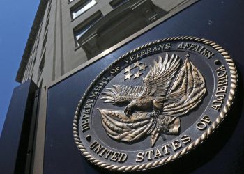 This is the seal affixed to the front of the Department of Veterans Affairs building in Washington. The federal government wrote duplicate checks to doctors who provided care for veterans, costing taxpayers $128 million in extra payments over the last five years, according to a new watchdog report out this week. In nearly 300,000 cases, private doctors were paid twice – once by the Veterans Health Administration and another time by Medicare – for the same care provided to veterans from 2017 to 2021, the Health and Human Services Office of Inspector General found in its report. (AP Photo/Charles Dharapak, File)