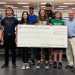 CCCF Executive Director Mark McCracken presents a 2022 CCCF Grant Award to Western PA Police Athletic League.  Organizations may begin filing online applications for 2023 grants on Monday August 7th. PICTURED L-R Jaidyn Pollnac, Masin Lundholm, Cooper Harris, Aviana Gillaugh, Gregg Gillaugh, Kristy Murphy, Gage Resch, Colton Edwards, Mark McCracken, Aaron Beatty and Holdin Lundholm.