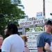 People stand in front of the sign for Tioga borough’s office.

Min Xian / Spotlight PA