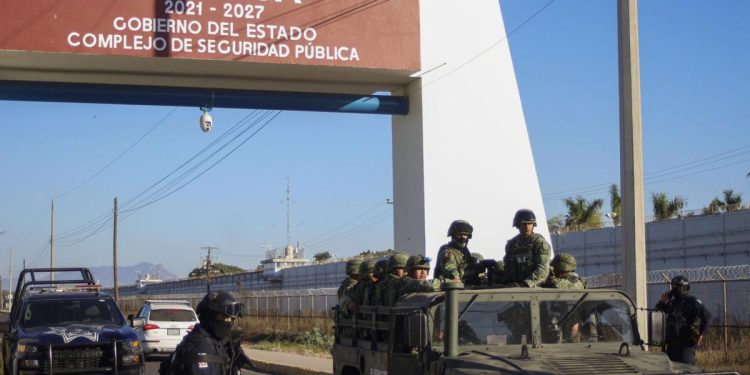 Police and military patrol Culiacan, Sinaloa state, Mexico, Jan. 6, 2023, the day after the government detained Ovidio Guzman, the son of imprisoned drug lord Joaquin "El Chapo" Guzman, which unleashed deadly firefights between the military and suspected members of the Sinaloa drug cartel. 

AP Photo/Martin Urista, File