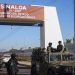 Police and military patrol Culiacan, Sinaloa state, Mexico, Jan. 6, 2023, the day after the government detained Ovidio Guzman, the son of imprisoned drug lord Joaquin "El Chapo" Guzman, which unleashed deadly firefights between the military and suspected members of the Sinaloa drug cartel. 

AP Photo/Martin Urista, File