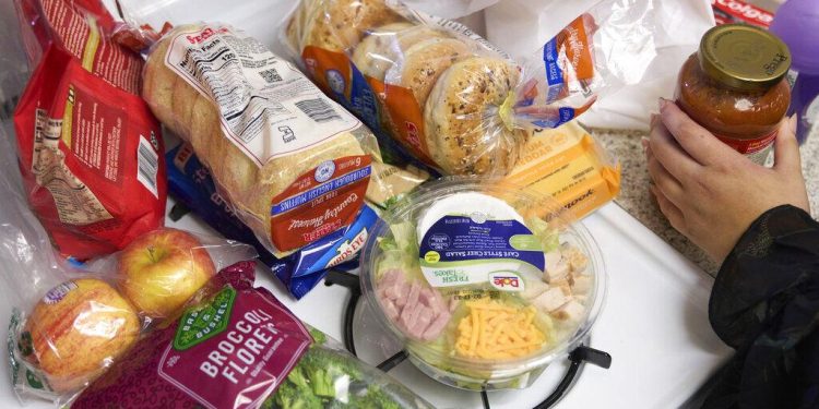 Jaqueline Benitez puts away groceries at her home in Bellflower, Calif., on Monday, Feb. 13, 2023. Benitez, 21, who works as a preschool teacher, depends on California's SNAP benefits to help pay for food.

Allison Dinner / AP Photo