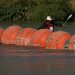 A kayaker passes large buoys being used as a floating border barrier on the Rio Grande Tuesday, Aug. 1, 2023, in Eagle Pass, Texas.

Eric Gay | AP