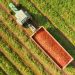 Aerial image of a Tractor and trailer loaded with Fresh harvested ripe Red Tomatoes.

StockStudio Aerials / Shutterstock