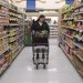 Jaqueline Benitez pushes her cart down an aisle as she shops for groceries at a supermarket in Bellflower, Calif., on Monday, Feb. 13, 2023. Benitez, 21, who works as a preschool teacher, depends on California's SNAP benefits to help pay for food.

Allison Dinner | AP