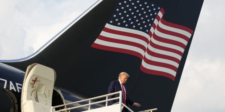 Former President Donald Trump steps off his plane as he arrives at Hartsfield-Jackson Atlanta International Airport, Thursday, Aug. 24, 2023, in Atlanta.

 
Alex Brandon / AP Photos