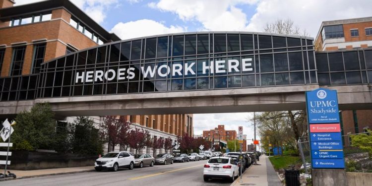 Heroes work here display on University of Pittsburgh Medical center hospital air bridge in 2010.

Ilze_Lucero | Shutterstock