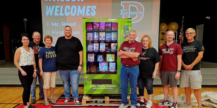 Wasson Elementary School in DuBois recently received an “Imagination Station” book vending machine from First Class Children’s Foundation and founder, Matt Reed (in black to the left of the machine).  The funds to purchase the machine were donated by Jennifer Reynolds-Hamilton, (far left) of Reynolds Financial Advisors. It is the third one in the DuBois School District. The others are at the C. G. Johnson Elementary School in Reynoldsville and the Juniata Elementary School in DuBois (Photo from First Class Children’s Foundation Facebook page)