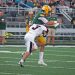 Brady Collins gets a hit on Forest Hills quarterback Nate Cornell just after releases the ball.