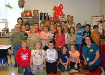 Mrs. Hughes' and Ms. Fry’s second-grade students from Harmony Elementary School are pictured with RACC staff member Amanda Davis.