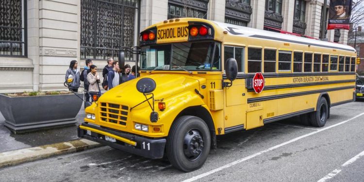 Students wait to board a school bus in Philadelphia.

4kclips | Shutterstock