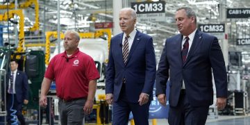 President Joe Biden walks with Mack Trucks President Martin Weissburg, right, and UAW Local 677 Shop Chairman Kevin Fronheiser, left, during a tour of the Lehigh Valley operations facility for Mack Trucks in Macungie, Pa., Wednesday, July 28, 2021. During his visit, he advocated for government investments and clean energy as ways to strengthen U.S. manufacturing.

Susan Walsh | AP Photo