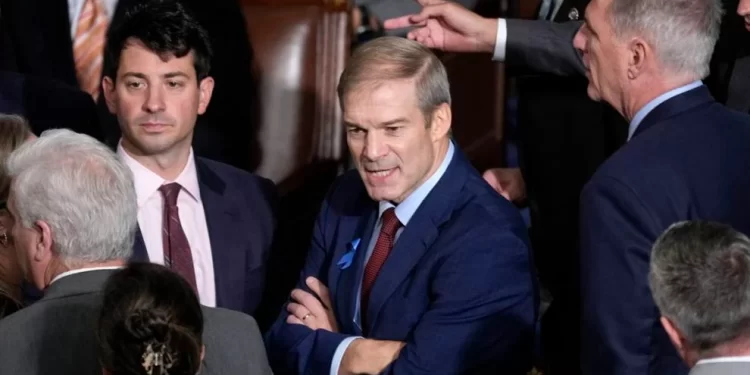 Rep. Jim Jordan, R-Ohio, chairman of the House Judiciary Committee, talks with members as the House convenes for a second day of balloting to elect a speaker, at the Capitol in Washington, Wednesday, Oct. 18, 2023. Former Speaker Rep. Kevin McCarthy, R-Calif., looks on at right.

J. Scott Applewhite | AP Photo