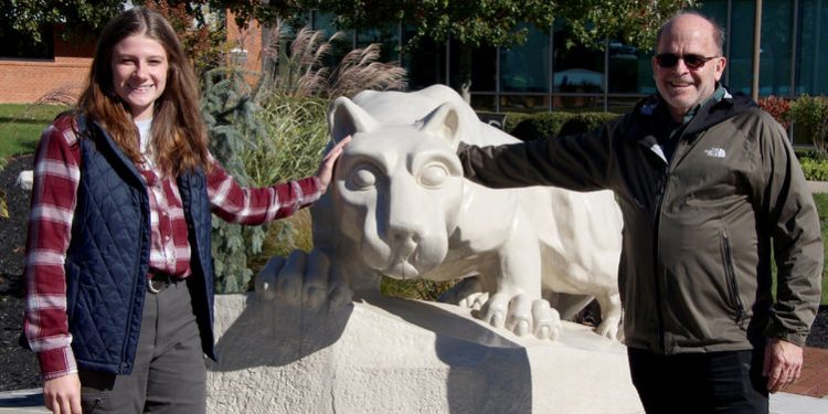 Gary Alt, right, stands at the Lion Shrine on the Penn State DuBois campus with student Elizabeth Bruner, left, who led the arrangement for the recent speaking engagement on campus.

Credit: Penn State