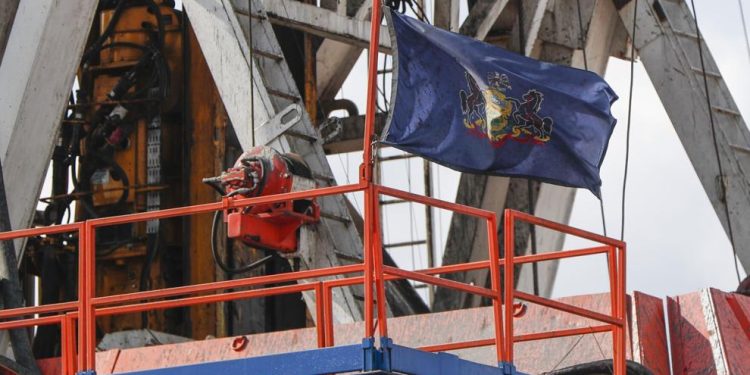 In this file photo from March 12, 2020, the flag of the Commonwealth of Pennsylvania flies on the drilling rig as work continues at a shale gas well drilling site in St. Mary's, Pa.

Keith Srakocic | AP Photo