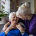 Woman hugging her elderly mother