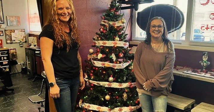 New Image Tattoo Studio staff member Jess Hoyt, left, and owner Chris Shaffer, have put up their fundraising Christmas Tree at the studio in support of MRAAA.