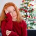 Depressed young red haired woman on christmas holiday