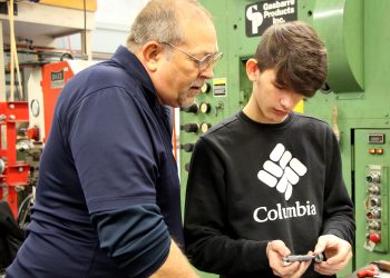 Penn State DuBois die setting instructor George Schneider, left, works with Saint Marys Area High School student Dakota Larkham to measure one of the parts produced during the high school die setter training program. (Submitted Photo).