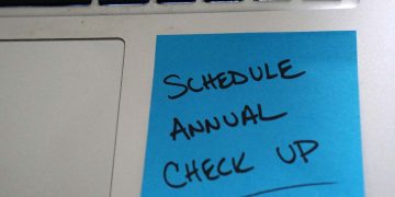 Sticky note reminder to schedule annual check up.