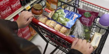 Jaqueline Benitez, who depends on California's SNAP benefits to help pay for food, shops for groceries at a supermarket in Bellflower, Calif., on Feb. 13, 2023. 

Allison Dinner / AP Photo