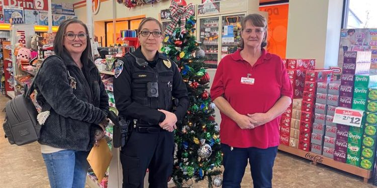 Giving Tree participants at one of the tree locations, Family Dollar in Clearfield.  Pictured, left to right, are Christina Shaffer, owner of New Image Tattoo Studio; Julie Curry, assistant chief, Clearfield Regional Police; and Bernice James, manager of Family Dollar.