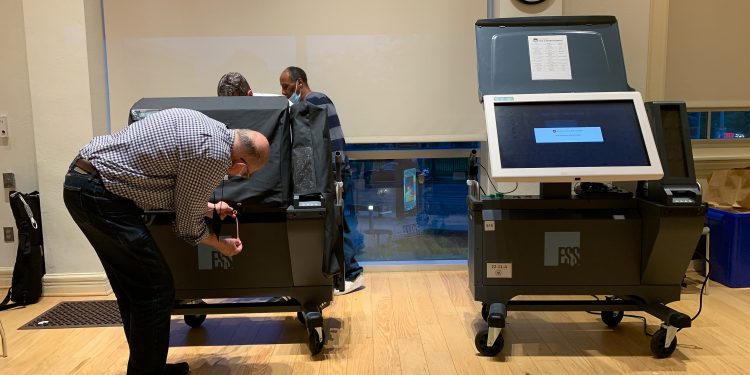 An election worker in Philadelphia, Pennsylvania examines an ExpressVoteXL voting machine during the 2022 primary.

Sue Dorfman / For Votebeat