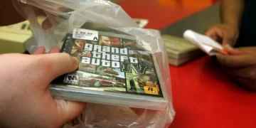 In this April 29, 2008 file photo, a clerk bags a copy of Grand Theft Auto IV at a Circuit City store in Los Angeles. Grand Theft Auto IV raked in more than $500 million in its first week in stores, selling more than 6 million units worldwide, said the video game's publisher, Take-Two Interactive Software Inc., on Wednesday, May 7, 2008. 

AP Photo/Reed Saxon