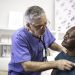 Doctor using a stethoscope listen to the heartbeat of the elderly patient