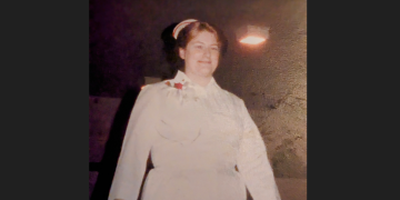 Nancy Farwell, RN, is shown early in her career wearing the former nurses uniform – white dress and cap.