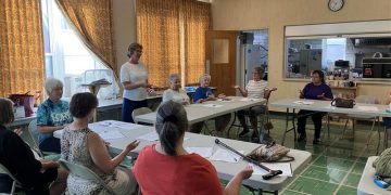 Health and Wellness Instructor Connie Harris, standing, leads a group in the Arthritis Foundation Exercise Program at the Clearfield Center for Active Living.