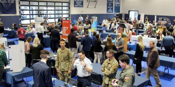 A full gym floor at the PAW Center, with the floor being full of employers, students, alumni and community members during the career fair.

Credit: Penn State