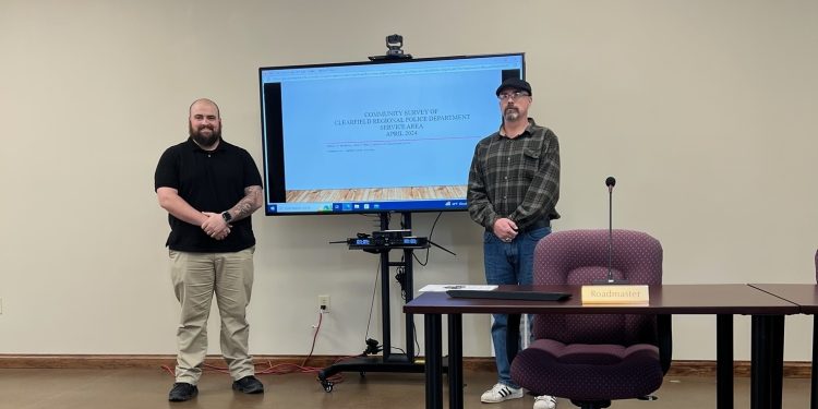 Commonwealth University-Clearfield student, Carl Dawes (left), and faculty member, Dr. Michael J. McSkimming present recent survey results gauging citizen satisfaction of police services.: