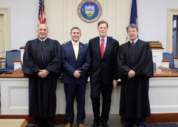 In the picture, from left to right, are Judge Paul E. Cherry, District Attorney Ryan P. Sayers, First Assistant District Attorney F. Cortez “Chip” Bell III, and Judge Fredric J. Ammerman.