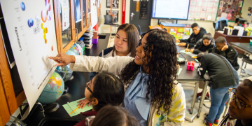 A teacher at West Dallas STEM School conducts a lesson with students. 
 PHOTO SOURCE: (c) Jason Kindig