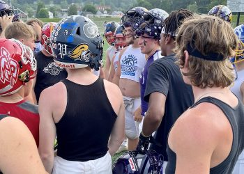 Members of the South team huddle before the Frank Varischetti Football All-Star Game last season. (Explore Jefferson).