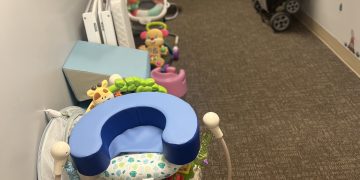 Toys and child seats line the hallway of a preschool and child care center.

Courtesy of Holli Zelinsky