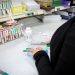 A pharmacy worker prepares a prescription.

Commonwealth Media Services