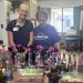 Shown on the longest day of the year with the pansies, cookies and individually decorated carnation bottles at Penn Highlands Elk Pinecrest Manor are (l. to r.) Danielle Heiberger, Adult Day Program Coordinator, Penn Highlands Adult Day Services, and Jeanette Stump, Facilitator for the Elk County Dementia Caregivers Support Group.