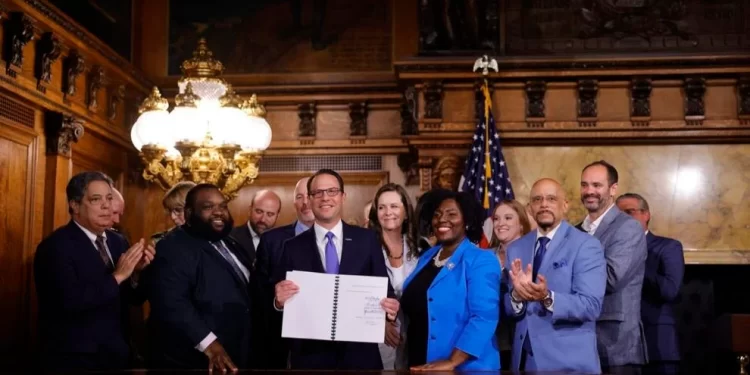 Gov. Josh Shapiro signs the 2024-25 budget, flanked by House and Senate Democrats, on July 11, 2024.

Commonwealth Media Services