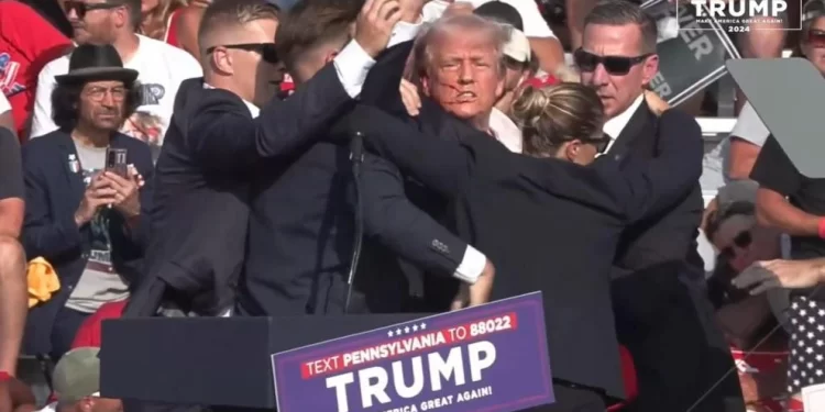 Former President Donald Trump, surrounded by U.S. Secret Service agents, pumps his first after pops were heard at his rally in Butler, Pa. on July 13, 2024. 

Donald J. Trump | Facebook