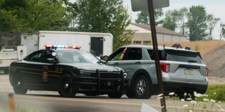 Police vehicles near the site of the Butler, Pa., venue where President Donald Trump was speaking when he was struck in the ear by a bullet in an assassination attempt

Grace David | For The Center Square