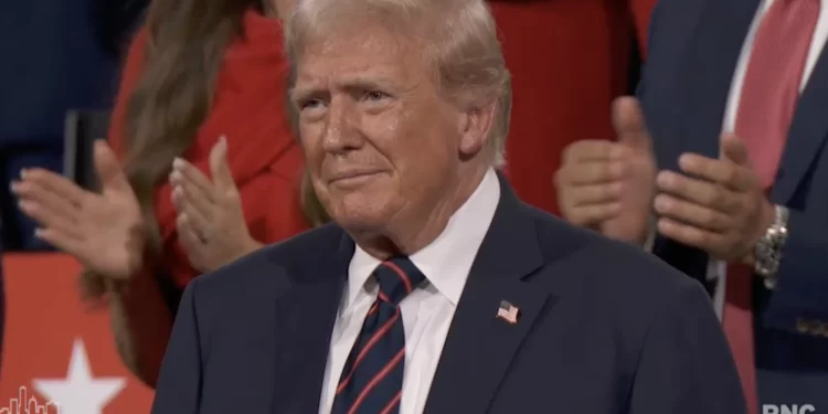 Donald Trump listens as U.S. Sen. J.D. Vance, R-Ohio, speaks at the Republican National Convention on Wednesday, July 17, 2024, in Milwaukee, Wis. Vance accepted the nomination to run as vice president on the ticket with Trump, the GOP presidential nominee.

Milwaukee.granicus.com