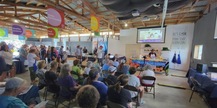 An audience watches a food demonstration by a Penn State Extension educator in the Family Room building at Ag Progress Days in 2023. Credit: Andy Hirneisen, Penn State Extension. All Rights Reserved.