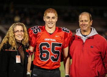 Timothy Piazza, along with his parents Evelyn and Jim, is seen in a photograph taken during his senior night in high school, prior to the events that unfolded during the initiation process of Penn State Beta Theta Pi fraternity in 2017. Photo courtesy of Patrick Carns.