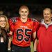 Timothy Piazza, along with his parents Evelyn and Jim, is seen in a photograph taken during his senior night in high school, prior to the events that unfolded during the initiation process of Penn State Beta Theta Pi fraternity in 2017. Photo courtesy of Patrick Carns.